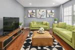 Ample living room features two soft fabric sofas -accommodates large gatherings-